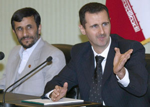 Syrian President Bashar al-Assad ( R)  and Iranan President Mahmoud Ahmadinejad. Net photo.