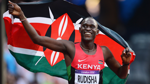 David Rudisha celebrates with the Kenyan flag after winning gold and setting a new world record of 1.40.91 in the men's 800m final at the Olympic Stadium on Thursday. Net photo.