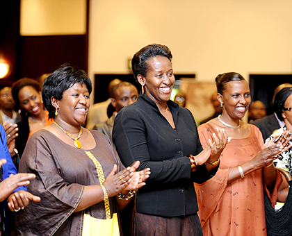 First Lady Mrs Jeannette Kagame and the Minister of Health Dr Agnes Binagwaho (L) applaud during the 10th Anniversay of Imbuto Foundation on Thursday. The New Times / T. Kisambira.