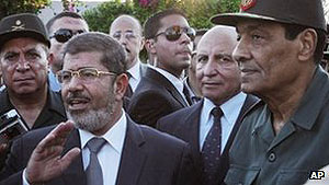 Relations between Mr Mursi (left) and Field Marshal Tantawi (right) have been tense