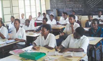 FAWE Girls Secondary School students in class. The issue of  drop out rates for girls must be tackled. The New Times / File.