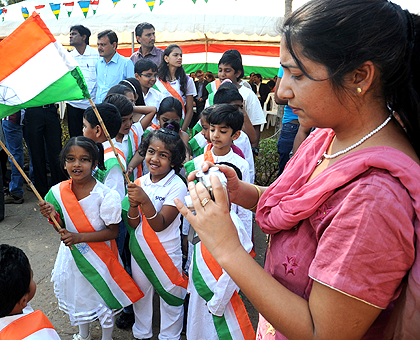 Indian Children donning their Countryu2019s flag to mark the 66th Anniversary of Independence yesterday. The New Times / John Mbanda.