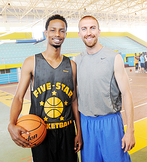 Lionel Hakizimana (L) and Los Angeles Lakersu2019 Point Guard Steve Blake. The New Times/J. Mbanda.