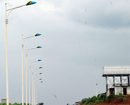 Lights are being installed on newly upgraded streets.  The New Times / John Mbanda.