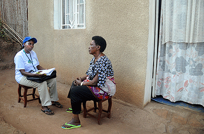 An enumerator (L)carrying out the census exercise. The New Times / File.