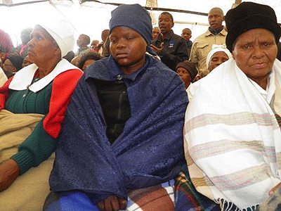 People gather on September 1 in Marikana, S. Africa, for the funeral service of a mine worker killed in recent violence at the Lonmin platinum mine. Net photo.