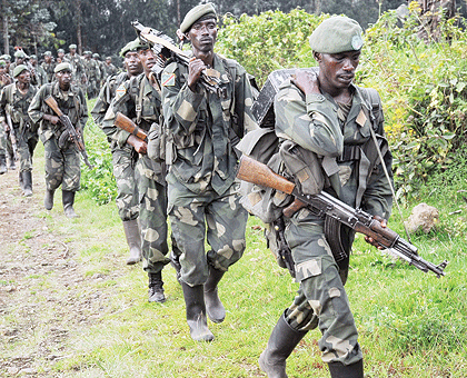 RDF Special Forces dressed in FARDC uniform, cross into Rwanda from DRC at Kabuhanga border post in Rubavu District on Saturday. The New Times/John Mbanda.