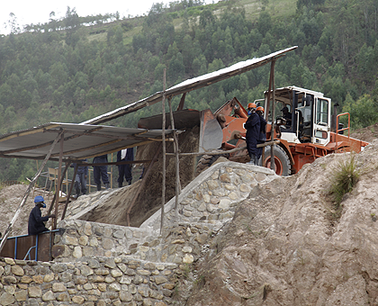 Miners at Mutobwe mining site; Rwandau2019s mineral exports have surged over the years.  The New Times / File.