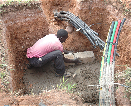 A man laying fibre optic cable in one of the sites in Kigali City.  (File Photo)