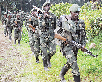 RDF Special Forces in Congolese army fatigues, returning home from DRCu2019s volatile Rutchuru region, where they were conducting joint operations with FARDC. The New Times / File.