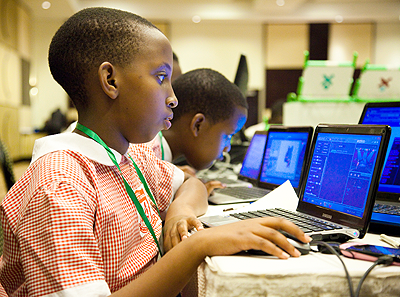 Pupils of Kigali parents working on a software called scratch during a conference on ICT in Education on Wednesday. The Sunday Times / Timothy Kisambira