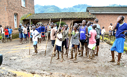 Students of Petit Seminarie Nyundo during a clean up exercise at one of their classroom blocks. The New Times Sam Nkurunziza.