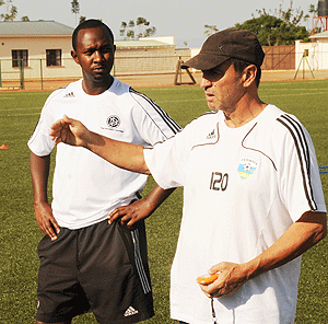 Vicent Mashami (L) is Richard Tardyu2019s (R) right-hand man with the junior wasps teams. The New Times / File.