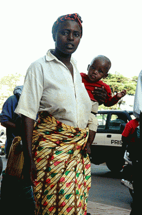A mother on a Kigali street with her baby.  The New Times / File.