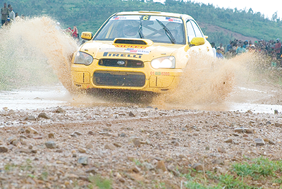 Rwandan national champion Davite Giancarlo cruises his Subaru Imprezza on a flooded road during a past event. The New Times/File.