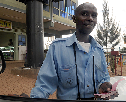 The demobilised soldiersu2019 cooperative is in charge of street parking in Kigali. The New Times / File.