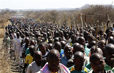 Mine workers take part in a march at Lonminu2019s Marikana mine in South Africa. Net photo.