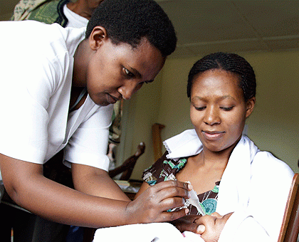 A nurse at Police hospital immunizing a Child. Early this week, Rwanda hit its MDG4 target on child mortality according to a report from UNICEF. The New Times / Timothy Kisambira.