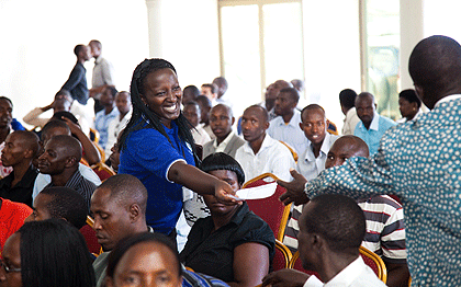 An usher receives contribution for the Agaciro Development Fund from a resident of  Kicukiro during a recent fundraising event. The New Times / Timothy Kisambira.
