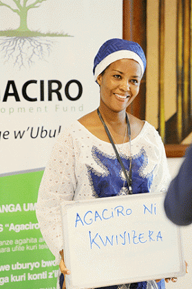 A lady displaying a placard of Agaciro during its launch last month.The New Times / File.