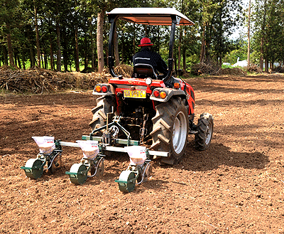 A man ploughing land using a tractor. Duterimbere Microfinance has launched new drive to boost mechanisation in agriculture. The New Times / File.