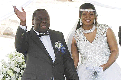 Zimbabwes Prime Minister Morgan Tsvangirai and partner Elizabeth Macheka smile after getting married under customary law in Harare. Net photo