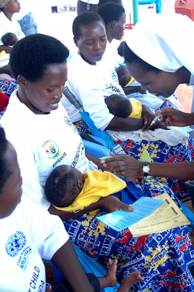 Mothers gather for an immunisation exercise. Massive immunisation campaigns have helped Rwanda's attainment of the MDG Four. The New Times / File.