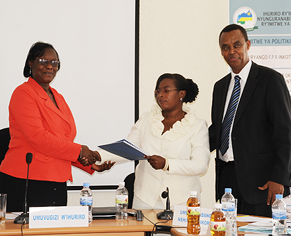 Mukabunani (C), the outgoing NFPO Mukabaramba, and the Forum Executive Secretary Anicet Kayigema. The New Times / T. Ishimwe.