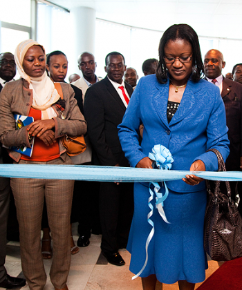 Minister for East African Community (EAC) Affairs, Monique Mukaruliza, (R) cuts a ribbon as Burundian EAC Minister Lu00e9ontine Nzeyimana looks on. The New Times / T.Kisambira.