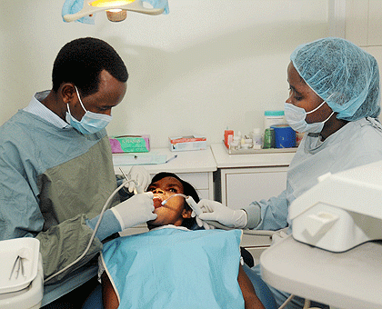 A dentist treats a patient; Experts say Oral health is a still a major problem among Rwandans. The Sunday Times / J. Mbanda.