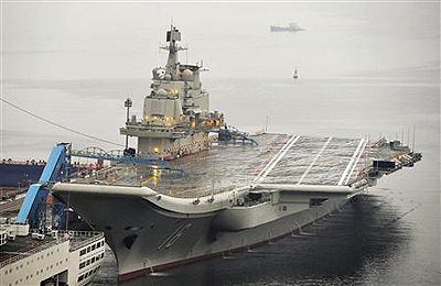 Chinau2019s first aircraft carrier, which was renovated from an old aircraft carrier that China bought from Ukraine in 1998, is seen docked at Dalian Port, September 22. Net photo.