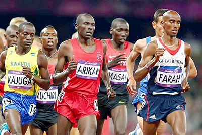 Robert Kajuga (L) made an impressive Olympic debut, finishing 14th in the 10,000m final. Net photo.
