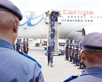 Rwandan Police peacekeepers on arrival at Kigali International Airport, from Haiti, yesterday. The Sunday Times / T. Kisambira.