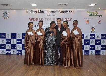 Rwandan dancers and co-chairman Indian Merchantu2019s Chamber Clarence Fernandes pose for a photo.  The Sunday Times / Courtesy.