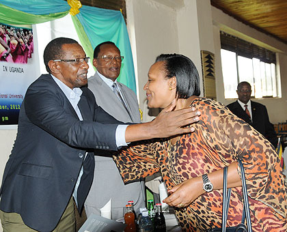 Rwandau2019s High Commissioner to Uganda, Frank Mugambage, welcomes Olive Kigongo, the Chairperson of the Uganda National Chamber of Commerce and Industry (UNCCI) to the Agaciro fundraising event.  The New Times / G. Muramira.