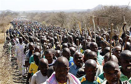 Mine workers take part in a march at Lonmins Marikana mine in South Africau2019s North West Province last month.  Net photo.