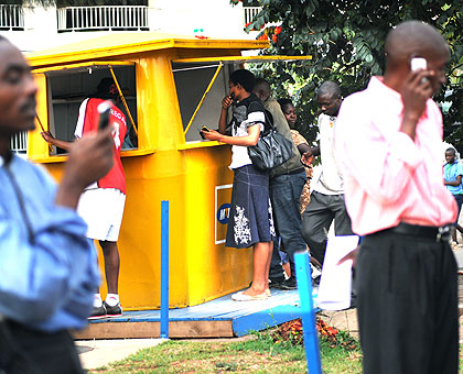 Some subscribers of MTN at a service outlet. The regulator has announced a reign in on fake mobile phones. The New Times / File.