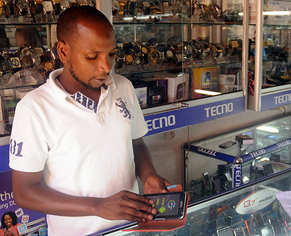 A phone dealer in downtown Kigali. The New Times / John Mbanda.