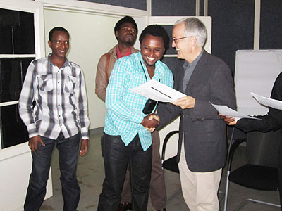 (R) Dr. Peter Stephan Director, Goethe Institute gives  certificates to the participants.  The New Times  / Andrew Israel Kazibwe.