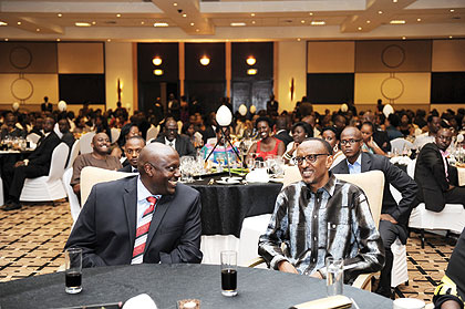 President Paul Kagame with Ugandau2019s High Commissioner to Rwanda, Richard Kabonero (left), at the event.
