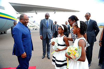 Children welcoming President Ali Bongo at Kigali International Airport last Friday.