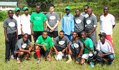 Fredrick Auger, Country Director, ARC (C), with residents of Karongi district.