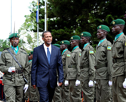 South African High Commissioner to Rwanda George Nkosinati Twala inspects a Guard of Honour at Village Urugwiro yesterday. The New Times / Village Urugwiro.
