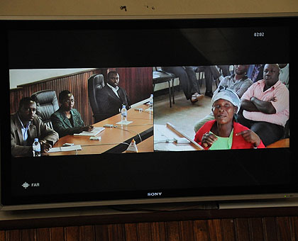 A plaintiff (R) in Western Province communicates with Supreme Court staff via Video link. The facility is now being used in the Bugingo trial from Norway. The New Times / File.
