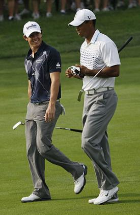 Rory McIlroy (L) and Tiger Woods during a past golf tournament.  Net photo.