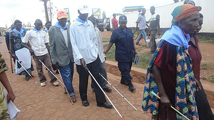 The visually impaired march during the event yesterday. The New Times / JD Mbonyinshuti.
