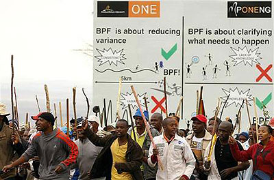 Striking miners chant slogans as they gather at the AngloGold Ashanti mine in Carletonville, northwest of Johannesburg. Net photo