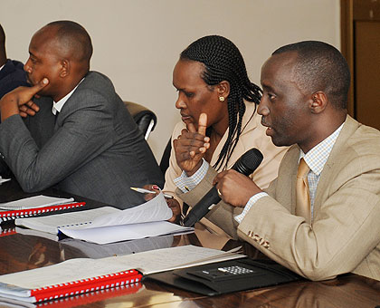 NAEB Director General Alex Kanyankole (R) responds to questions from PAC yesterday.  The New Times / John Mbanda.