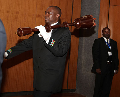 EALA Sergeant at arms making an entrance to mark the beginning of an EALA session in Kigali in the past. The New Times / File.