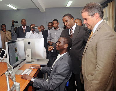 Education Minister Vincent Biruta (2nd right) tours the Kigali based Africa Digital Media Academy yesterday. The New Times / John Mbanda.